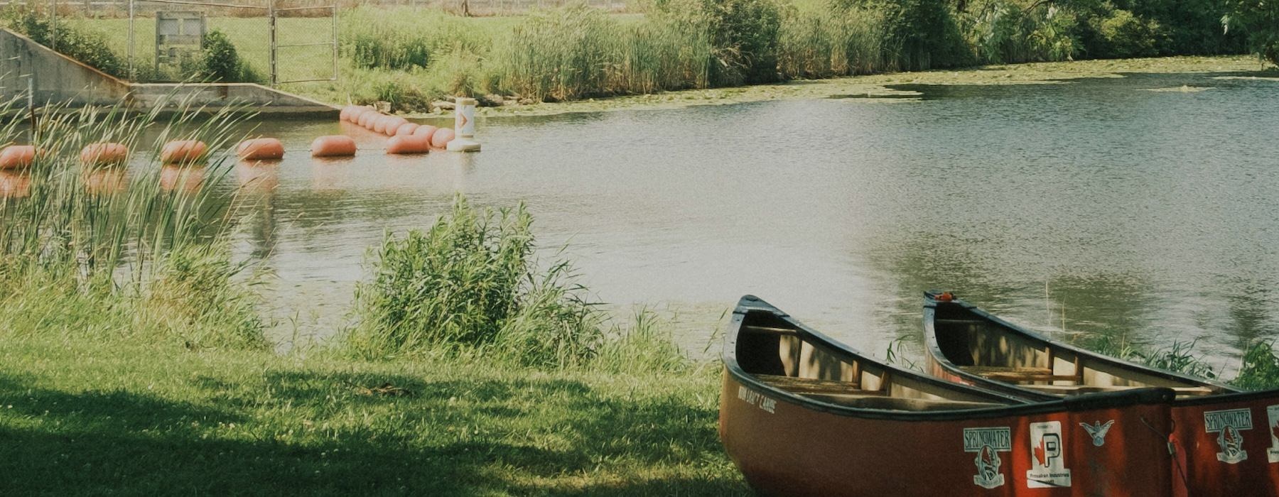 a couple of boats by a body of water