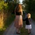 a person and child walking down a path